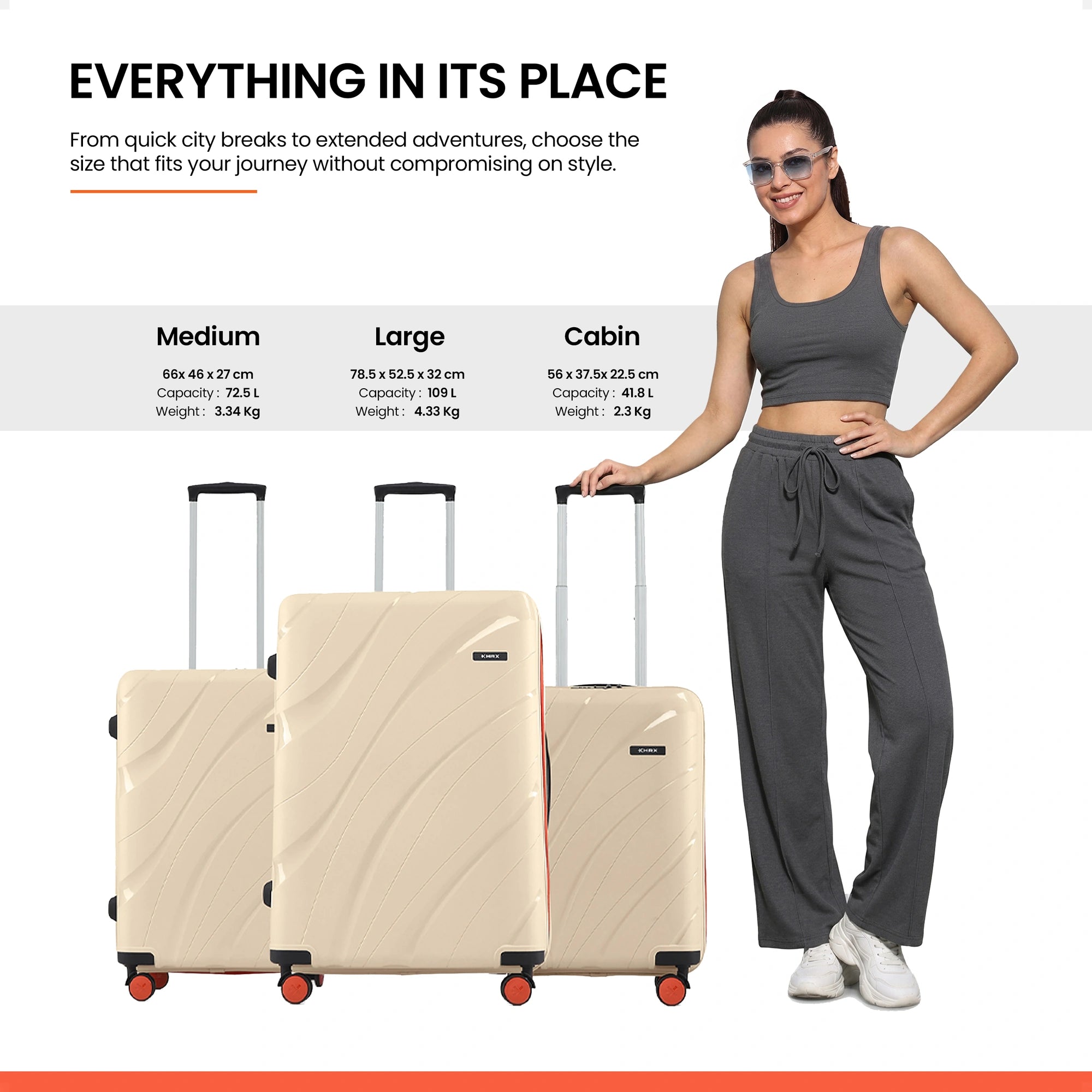 Stack of three beige rolling suitcases with telescopic handles and spinner wheels