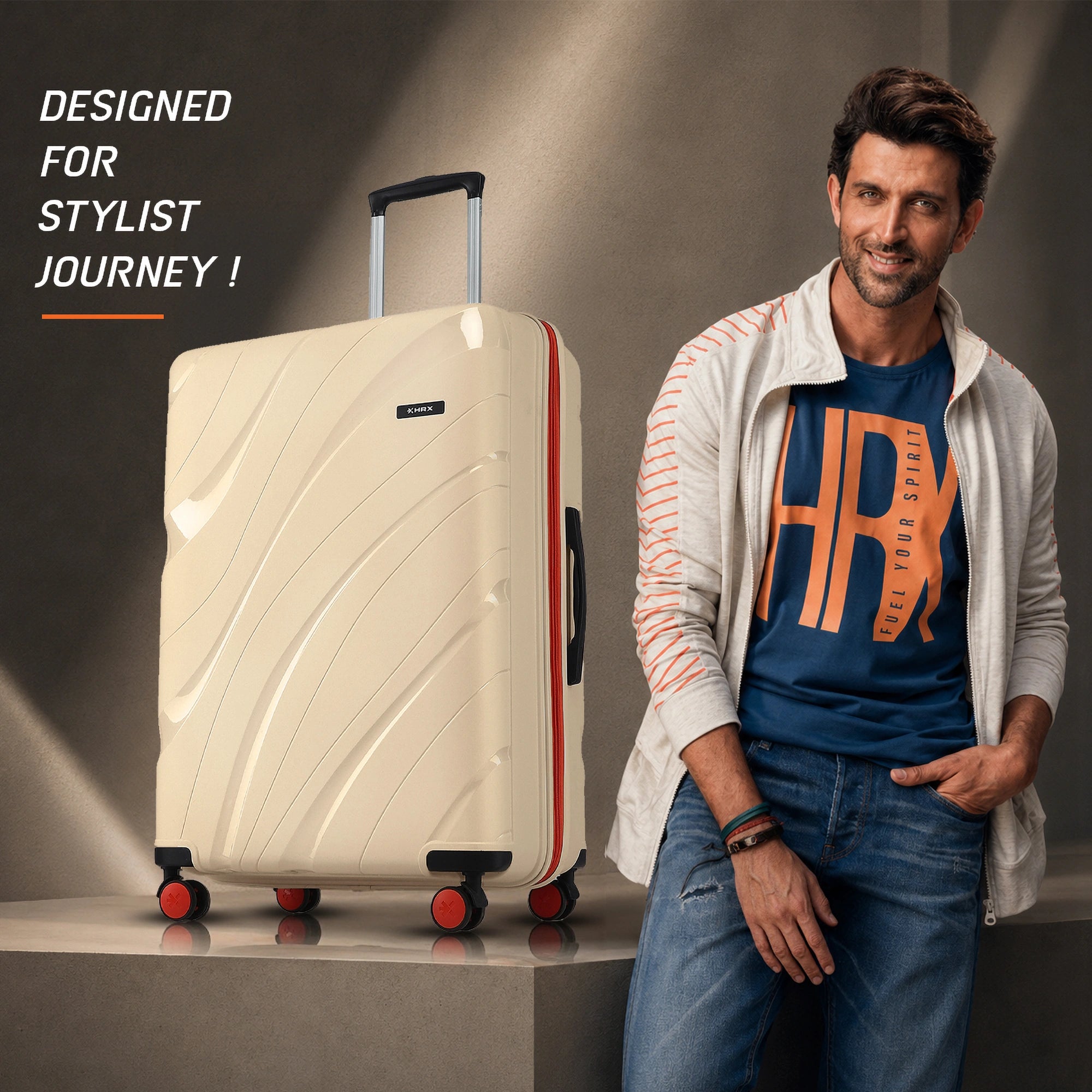 Beige hard-shell suitcase with telescopic handle and red-accent spinner wheels