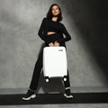 Small cabin suitcase in white with extended handle and 8 spinner wheels