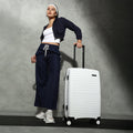 White hardshell check-in suitcase with upright handle and four-wheel base