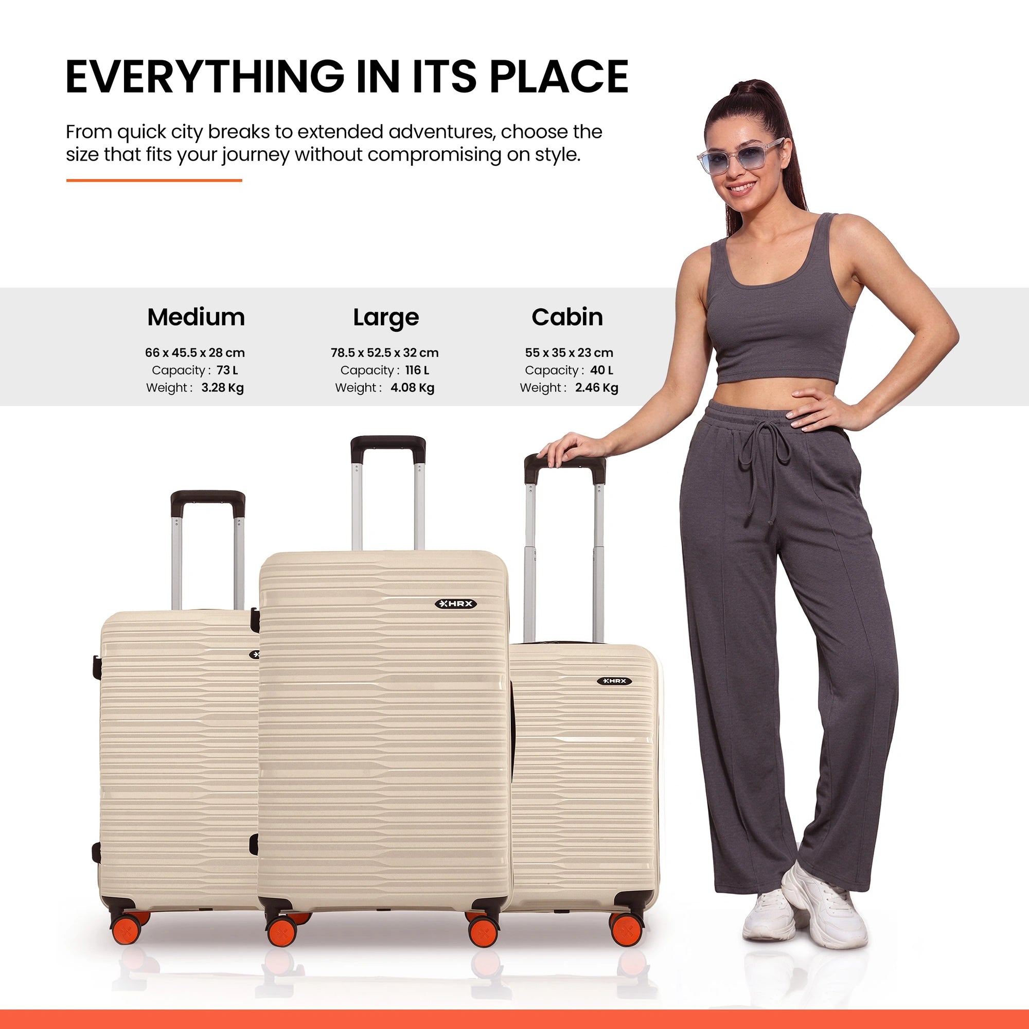 Beige medium, large, and cabin luggage stacked with 8-wheel design