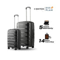 2-piece trolley set with dark hard shells, telescopic handles, and spinner wheels