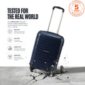 Navy cabin trolley with telescopic handle and four spinner wheels, durable hard shell.