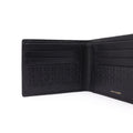 Black leather bi-fold wallet open, showing card slots and embossed panel