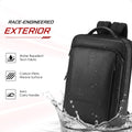 Black backpack exterior with water droplets on a carbon-fiber weave surface.