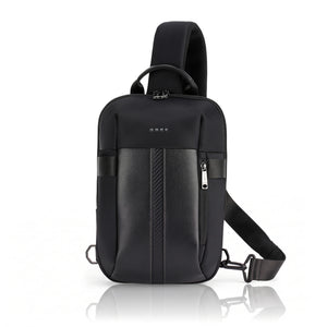 Black nylon crossbody sling bag with top handle and front vertical zipper pocket.