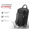 Water-repellent black crossbody backpack with carbon-fiber weave textured surface.