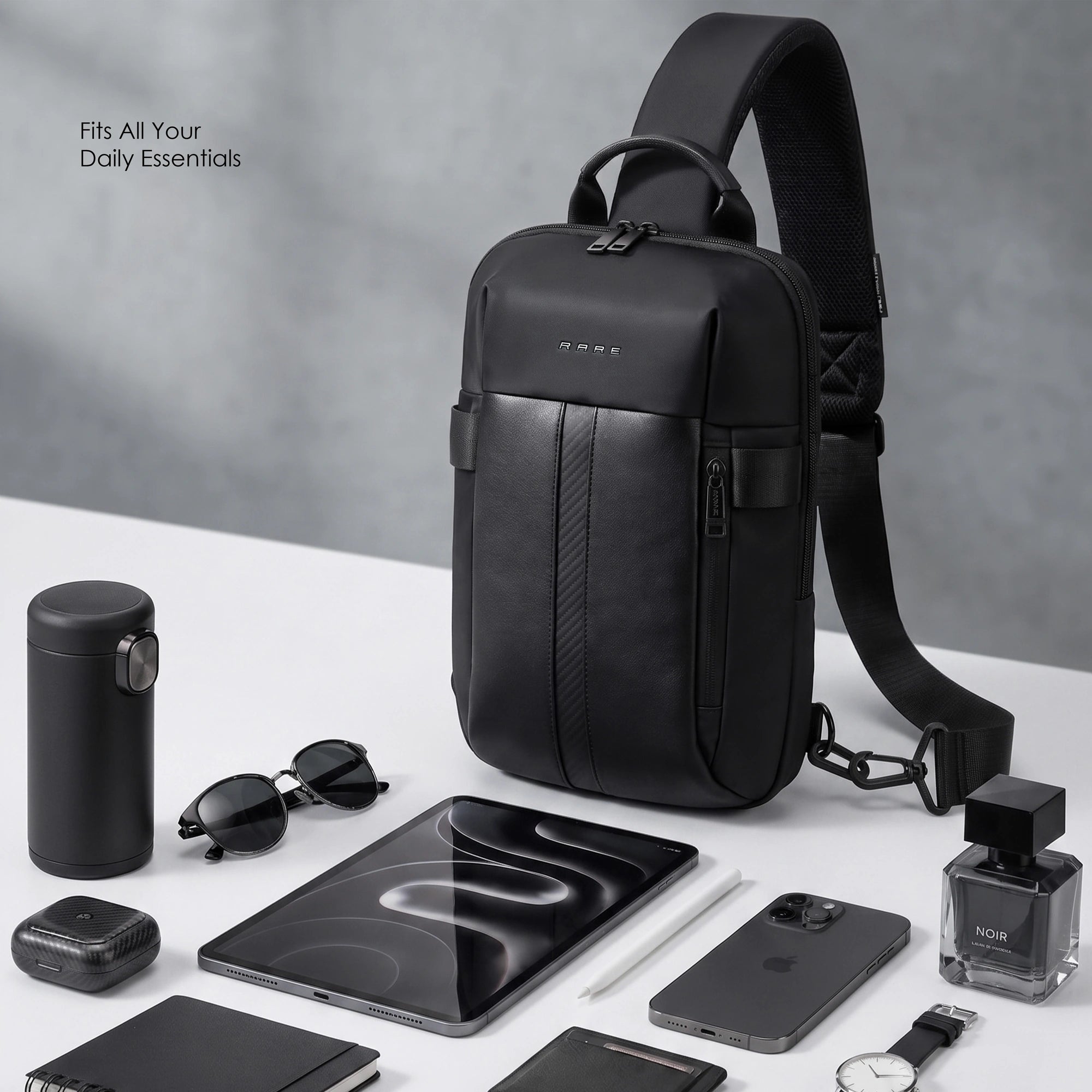 Black nylon crossbody sling bag with top handle, front pocket, and slim profile.