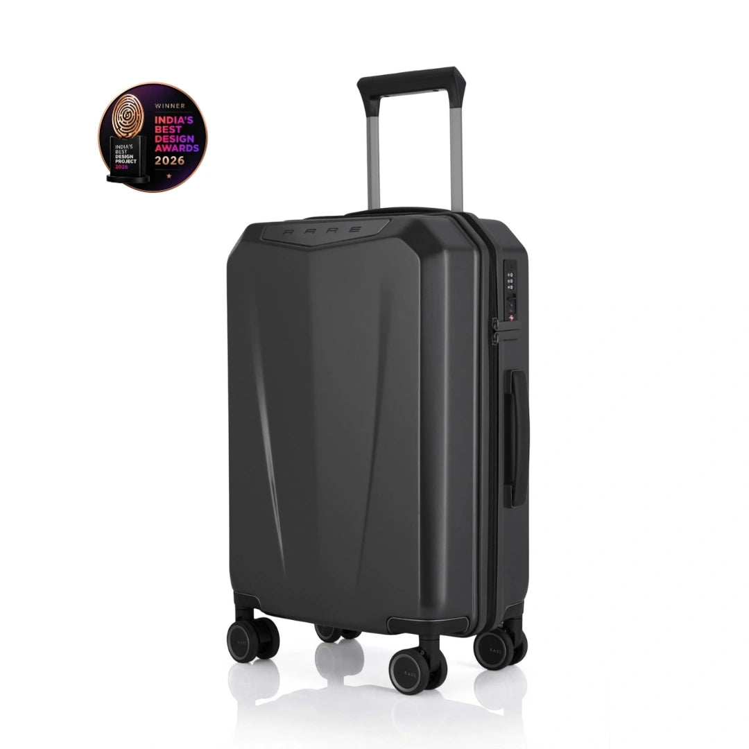 Dark grey hard-shell polycarbonate trolley suitcase with telescopic handle and four wheels