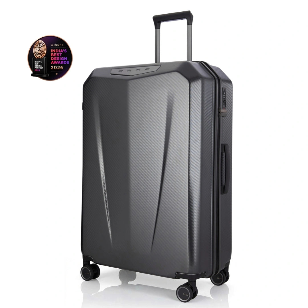 Hard-shell trolley suitcase, dark grey polycarbonate shell with side zipper and caster wheels