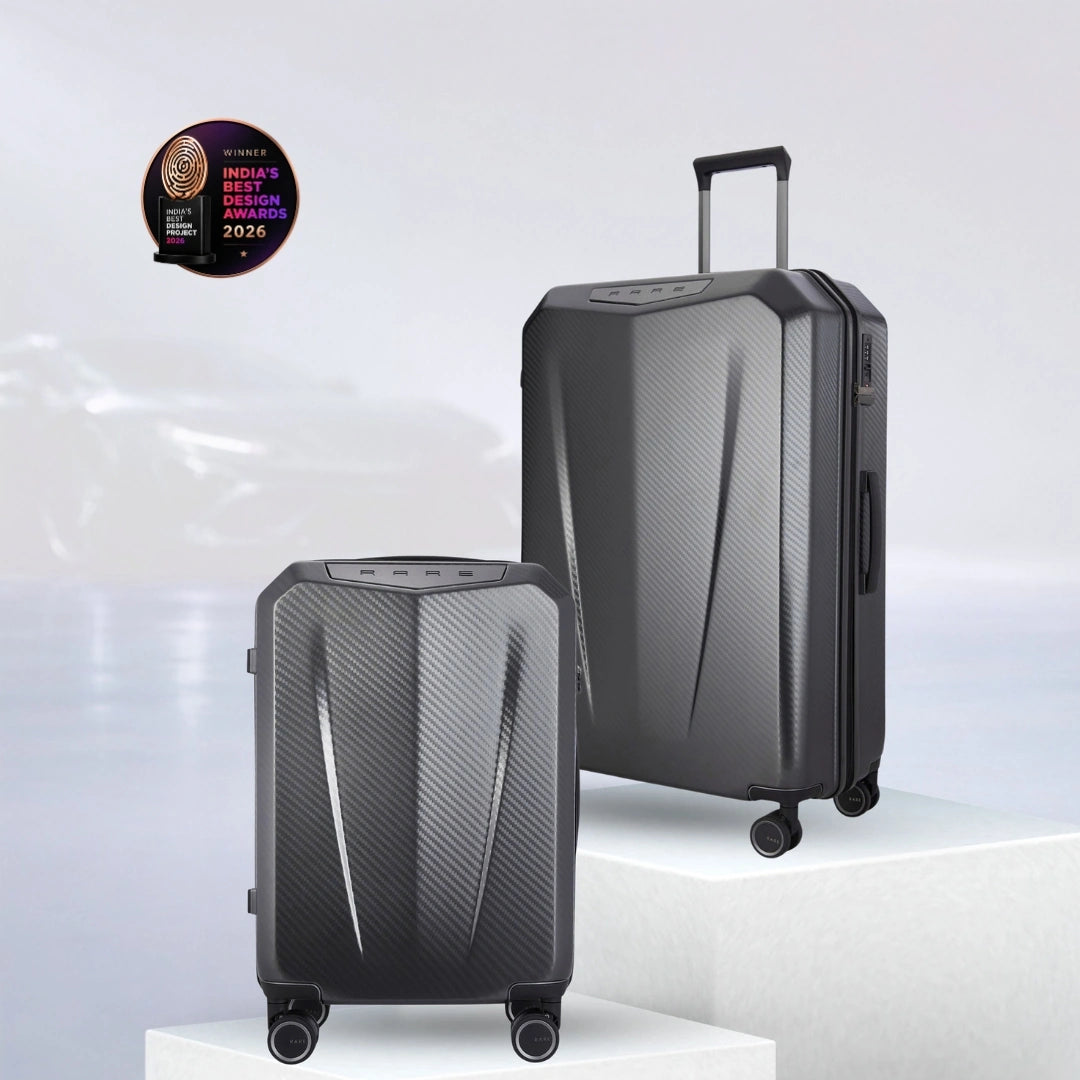 Set of hard-shell trolley suitcases, dark grey polycarbonate shells with handles and caster wheels