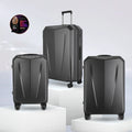 Set of three dark grey hard-shell polycarbonate trolley suitcases with telescopic handles