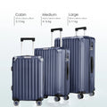 Cabin, medium, and large blue polycarbonate suitcases with spinner wheels