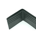 Dark green leather bifold wallet interior with card slots and center seam