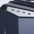 Hard-shell trolley luggage lid with glossy edge trim and raised letter branding