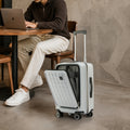 Off-white polycarbonate cabin trolley with front laptop compartment and 8 wheels