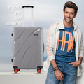 Medium check-in suitcase, grey hard shell with 8 spinner wheels and telescopic handle