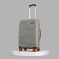 Medium check-in suitcase with 8 wheels, light blue ribbed shell, telescopic handle