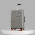 Large upright check-in suitcase, light blue ribbed shell, orange corner wheels