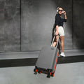Small cabin suitcase, grey ribbed PP shell with orange trim, 8 wheels, 56 cm