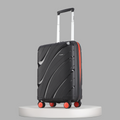 Small cabin suitcase in black with telescopic handle and 8 wheels, red trim