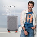 Grey cabin suitcase with telescopic handle and red wheels, front side view