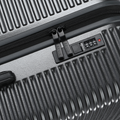 Dark grey hard-shell suitcase detail: zipper track and built-in handle control panel