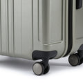 Hardside check-in suitcase with 8 wheels and telescopic handle, metallic finish