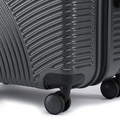 Suitcase wheel and corner bumper on charcoal ribbed shell, 8-wheel base.