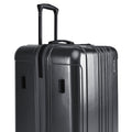 Hard-shell luggage set with upright handle and textured shell, dark silver gray