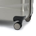Large check-in suitcase, silver-toned shell with front spinner wheels and side zipper track
