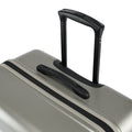 Silver suitcase top carry handle with black grip and ridged shell