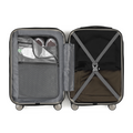 Small cabin suitcase interior in grey with open compartments, straps, and mesh pocket