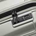 Small cabin suitcase with zipper and TSA-style lock panel, silver hard shell