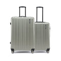 Pair of silver hard-shell suitcases with telescopic handles and spinner wheels