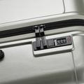 Large check-in suitcase, silver combo-lock panel with TSA-style latches and 8 wheels