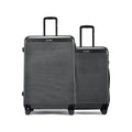 HRX suitcase pair with telescopic handles, ribbed dark shells, and wheels