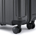 Small cabin suitcase with 4-wheel base, dark charcoal grey shell, and corner bumper.