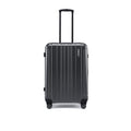 Charcoal grey check-in suitcase, side view with ribbed shell and telescopic handle.