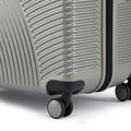 Hard-shell spinner suitcase, light silver-gray bottom with black 8-wheel casters
