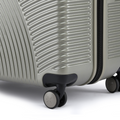 Hard-shell silver suitcase base with four wheels and recessed foot