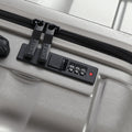 Hard-shell suitcase front-mounted TSA-style combination lock panel, light silver
