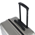 Hard-shell suitcase corner with integrated top carry handle, light silver
