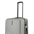 Silver hard-shell suitcase showing side zipper area and black combination lock