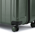 Dark green hard-shell suitcase corner with recessed handle and corner wheels