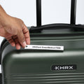 Dark green suitcase top with HRX logo and label on front panel