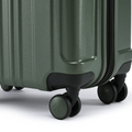 Dark green small cabin suitcase bottom with molded feet and 4 spinner wheels