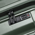 Small cabin suitcase with TSA-style combo lock detail on dark green body