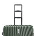 Dark green hard-shell luggage set stacked with multiple upright handles