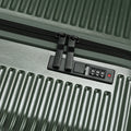Hard-sided suitcase, dark green ribbed shell, zipper pull and built-in lock panel